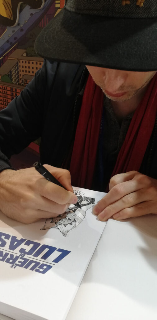 Lucca Comics and Games: Renaud Roche mentre disegna la dedica sul Libro "Le Guerre di Lucas"